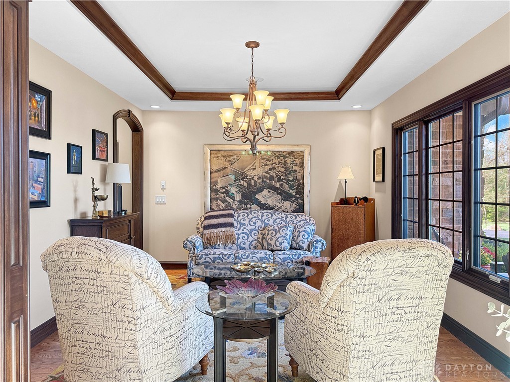 4096 Middle Urbana Road Urbana, OH 43078 - Photo 20 of 96 This inviting room features a coffered ceiling and large windows, creating an elegant and bright dining space.