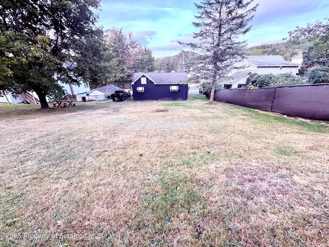 a view of patio with a yard
