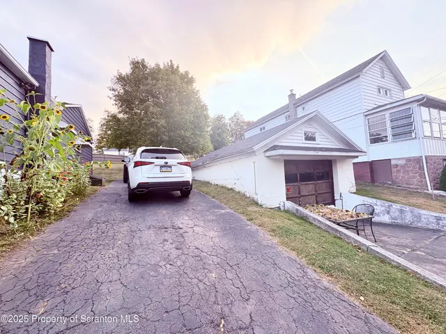 a car parked in front of a house
