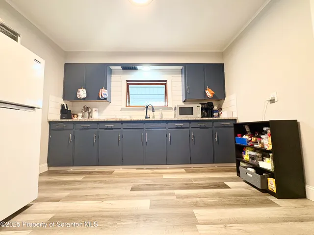 a bathroom with a sink double vanity and a mirror