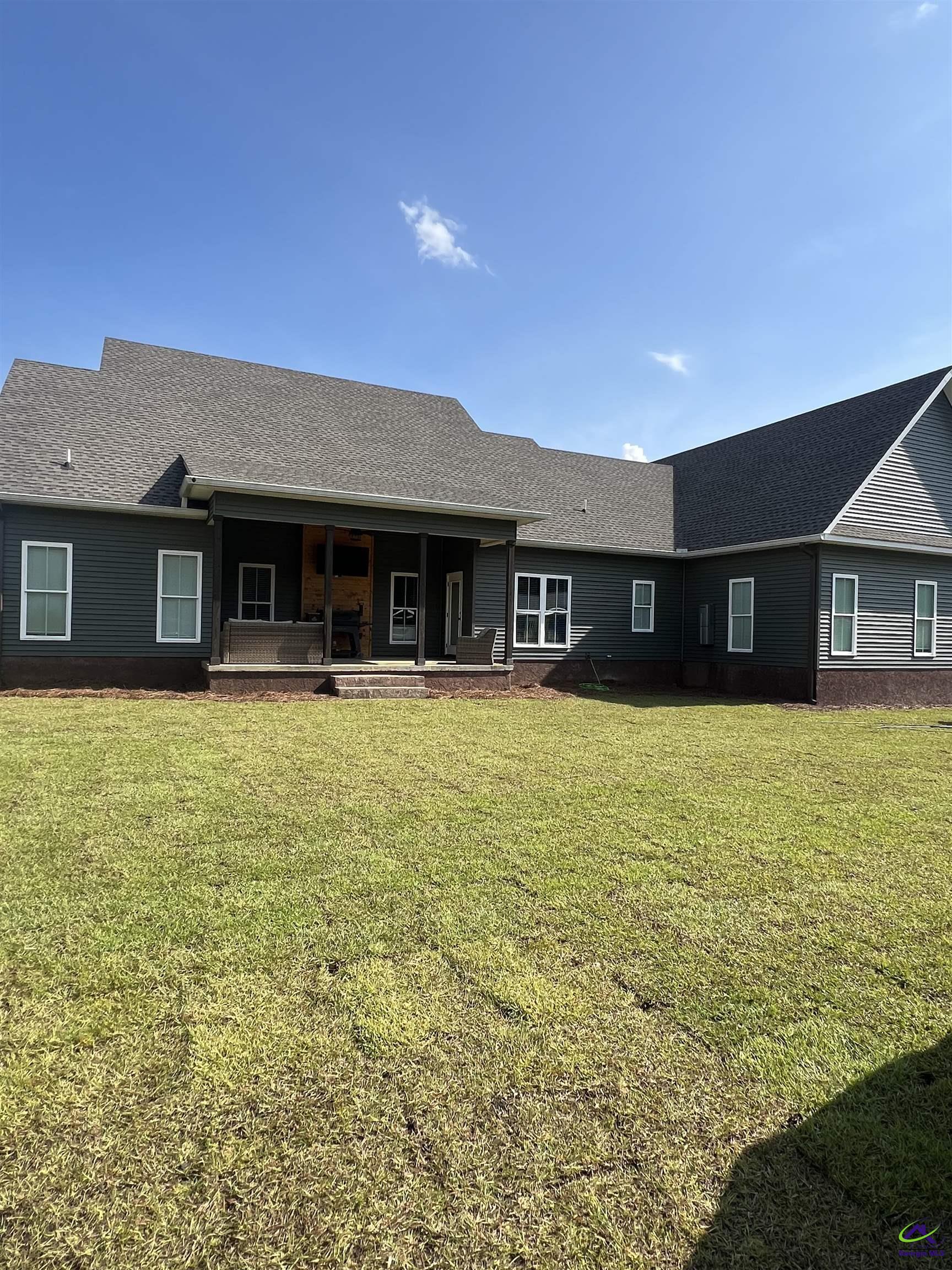 2203 Old Macon Road Montrose, GA 31065 - Photo 5 of 64 a front view of a building with a ocean view