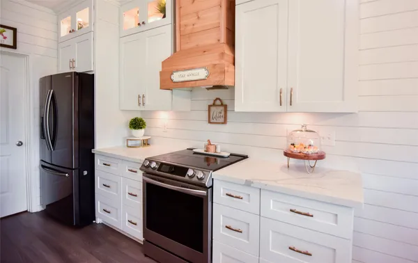 a kitchen with stainless steel appliances a stove and a refrigerator