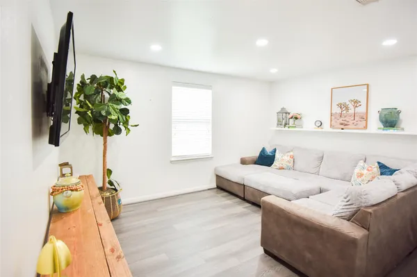 a bedroom with a bed and a couch