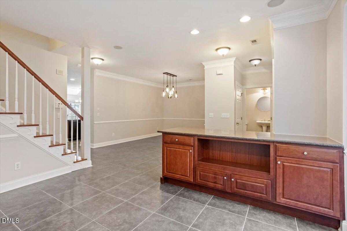 11213 Maplecroft Court Raleigh, NC 27617 - Photo 12 of 44 a view of cabinets and wooden floors