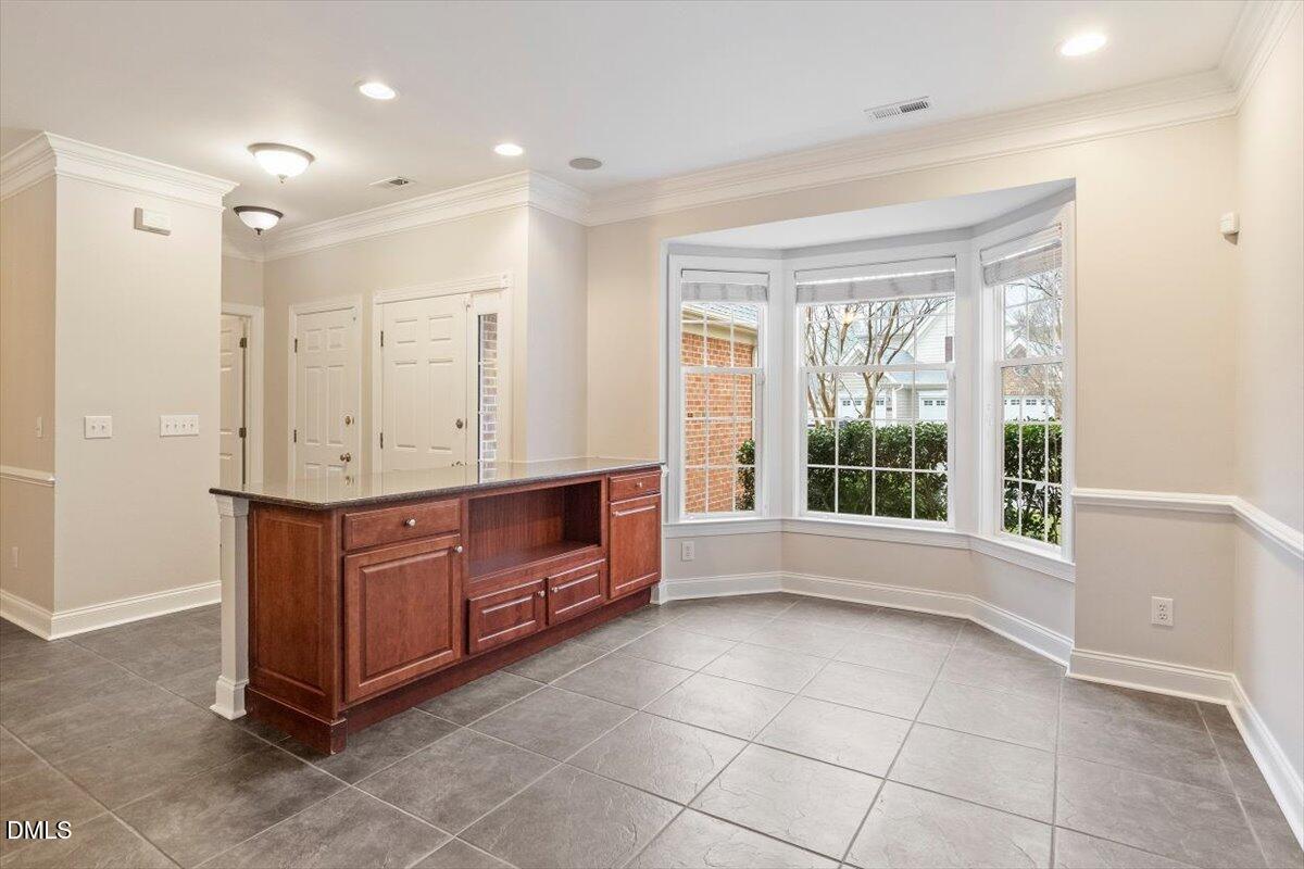 11213 Maplecroft Court Raleigh, NC 27617 - Photo 14 of 44 a room with a large window