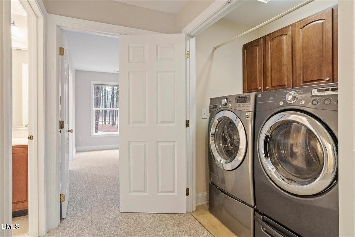 11213 Maplecroft Court Raleigh, NC 27617 - Photo 20 of 44 a view of a hallway with washer and dryer