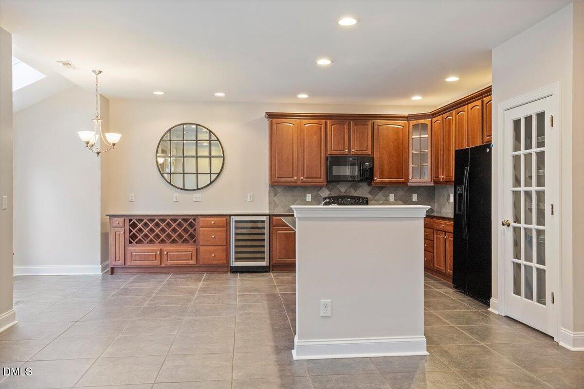 11213 Maplecroft Court Raleigh, NC 27617 - Photo 4 of 44 a view of kitchen with cabinets and stainless steel appliances