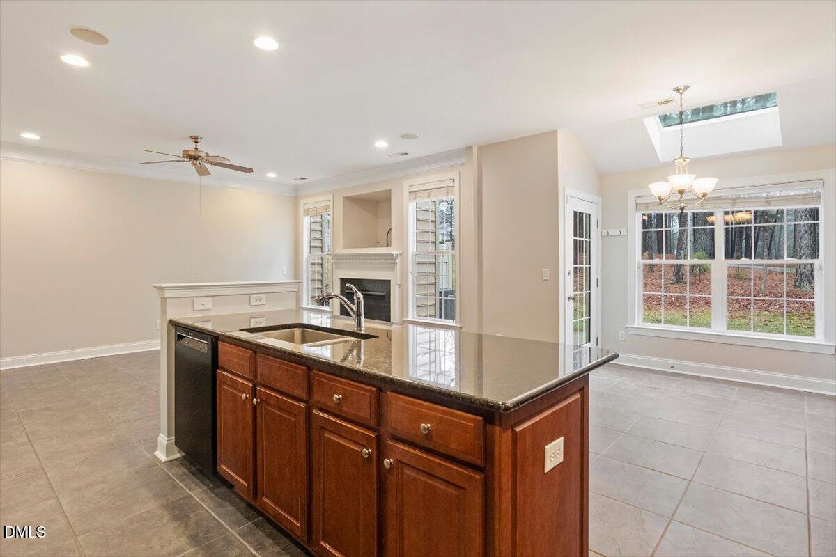 11213 Maplecroft Court Raleigh, NC 27617 - Photo 6 of 44 a kitchen with stainless steel appliances a sink and a stove