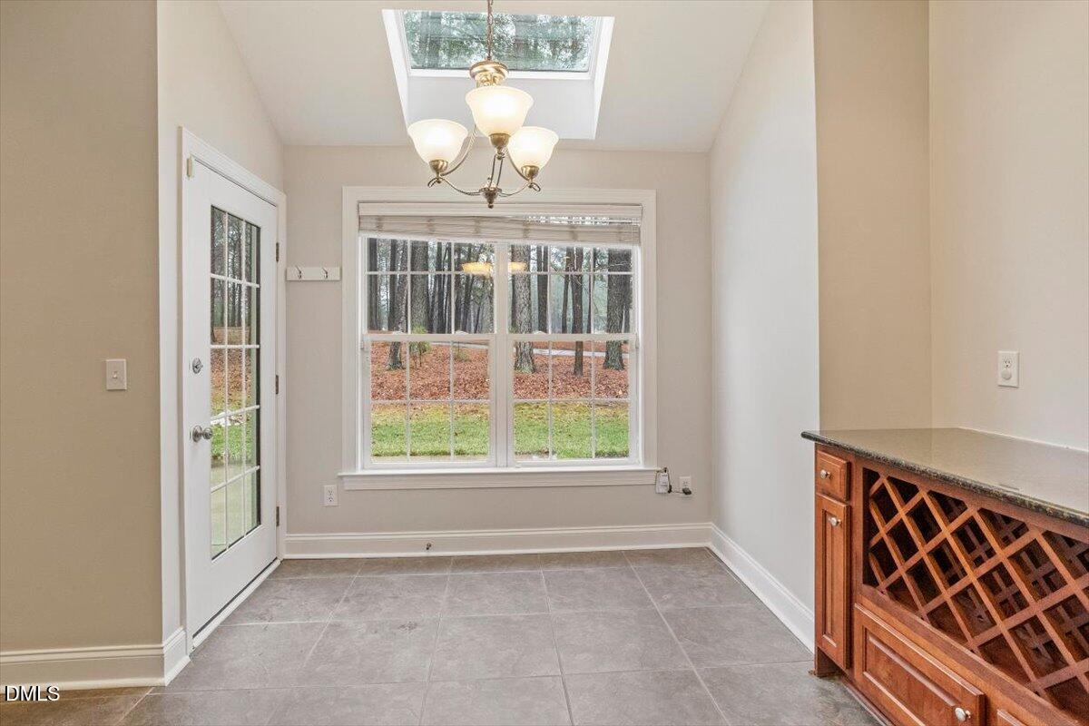 11213 Maplecroft Court Raleigh, NC 27617 - Photo 7 of 44 an empty room with windows