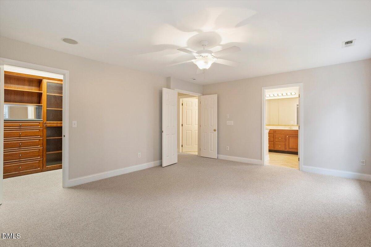 11213 Maplecroft Court Raleigh, NC 27617 - Photo 8 of 44 an empty room with windows and closet