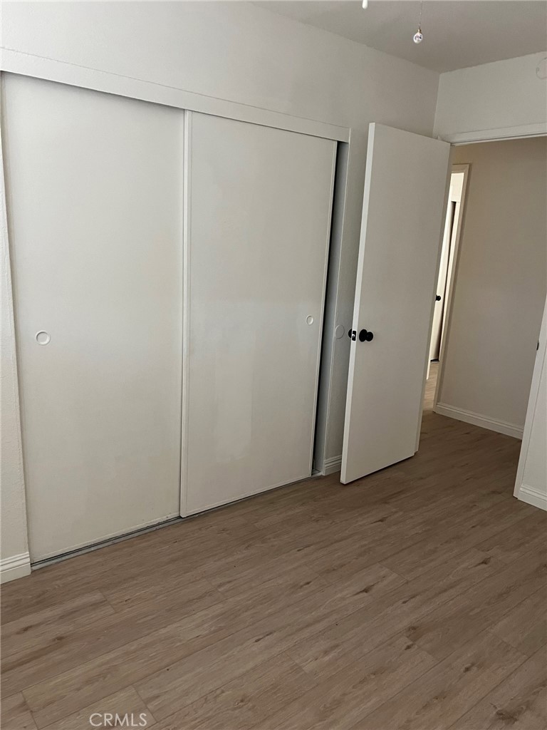 37920 Grandview Avenue Yermo, CA 92398 - Photo 7 of 11 a view of an empty room with wooden floor and a window