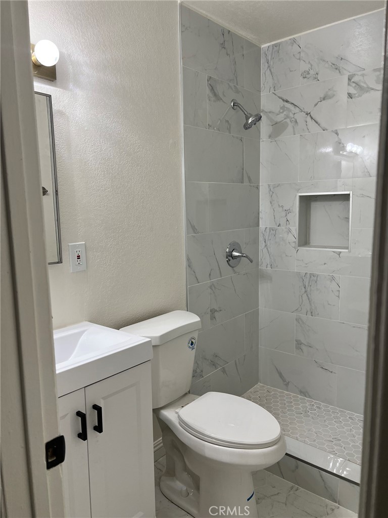 37920 Grandview Avenue Yermo, CA 92398 - Photo 8 of 11 a white toilet sitting next to a bathroom sink