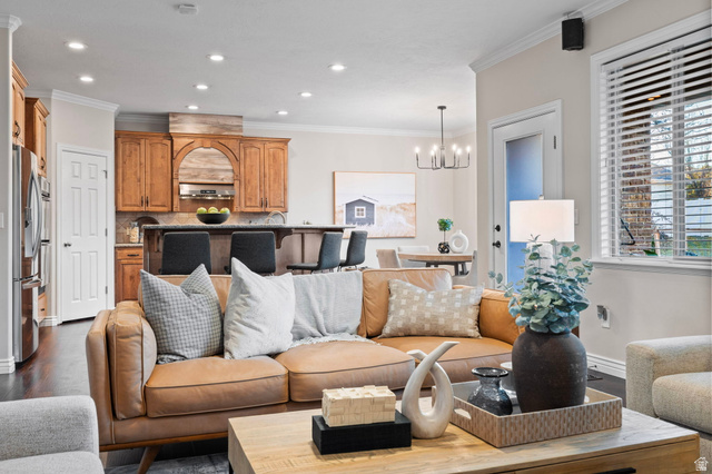 6208 West Bull River Road Highland, UT 84003 - Photo 20 of 90 Open-concept living space featuring recessed lighting and crown molding