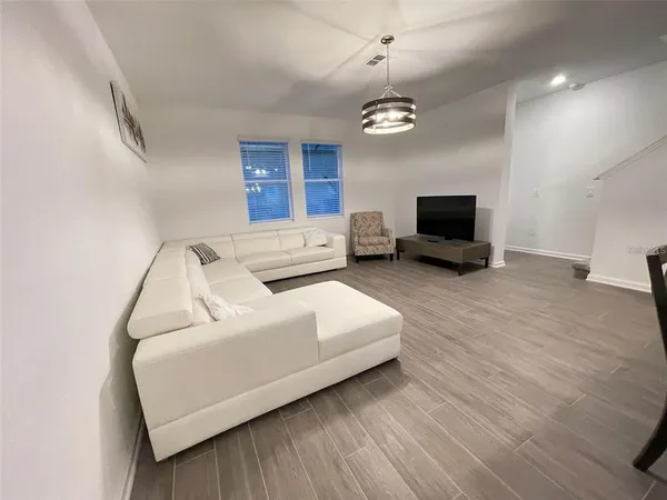 a metallic refrigerator freezer sitting in a kitchen