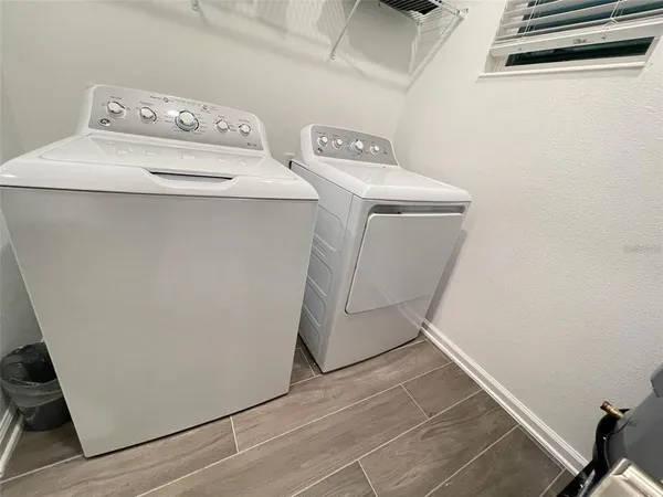 a utility room with dryer and washer