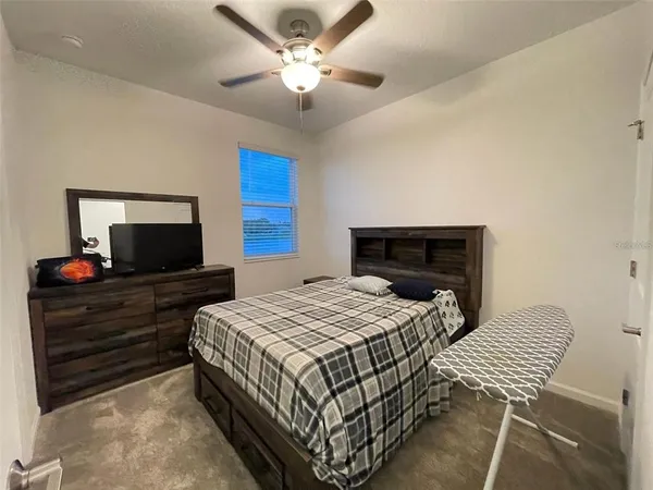 a bathroom with a sink toilet and a mirror