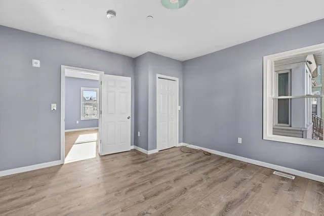 a view of livingroom with window and hardwood floor