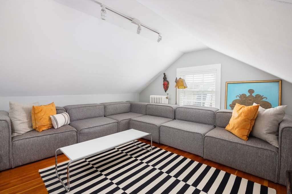 228 Wolcott Road Brookline, MA 02467 - Photo 13 of 29 a living room with furniture and a window