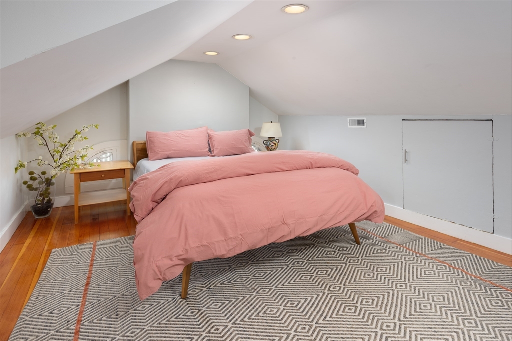 228 Wolcott Road Brookline, MA 02467 - Photo 14 of 29 a bed room with a bed and a couch