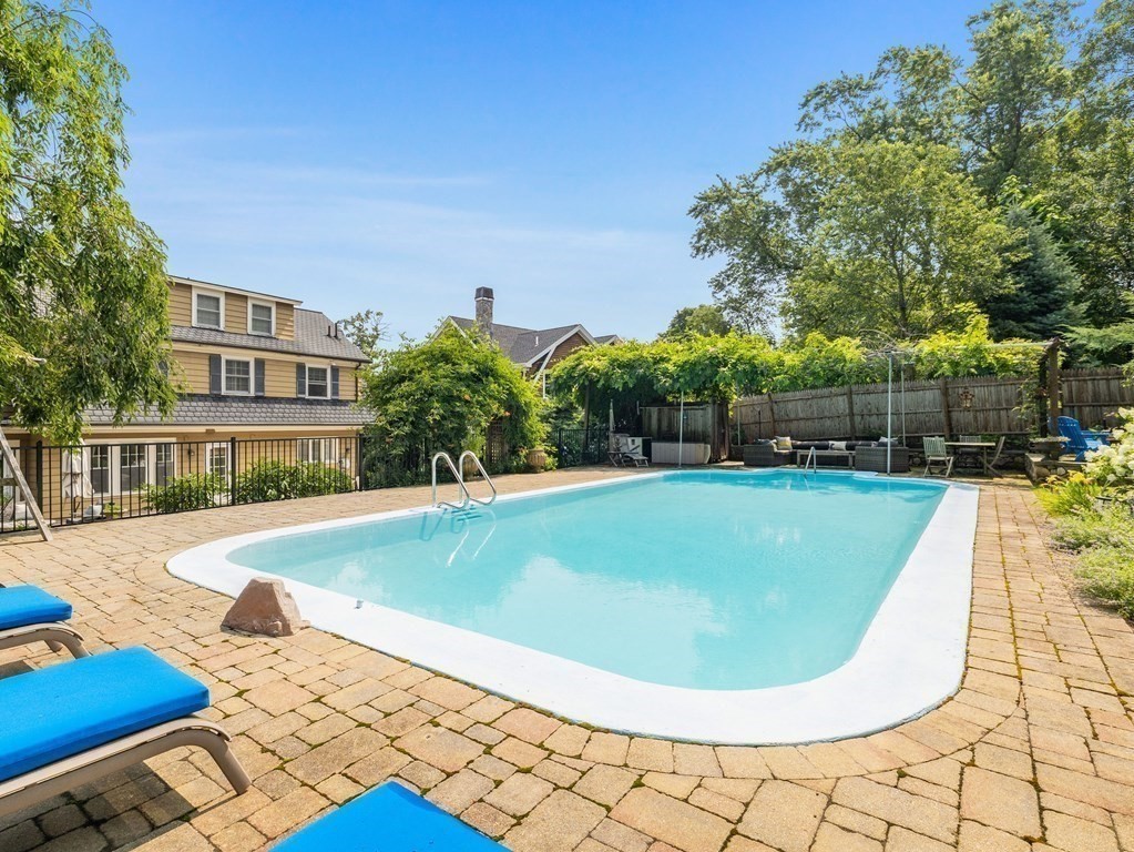 228 Wolcott Road Brookline, MA 02467 - Photo 17 of 29 a view of outdoor space yard swimming pool and patio