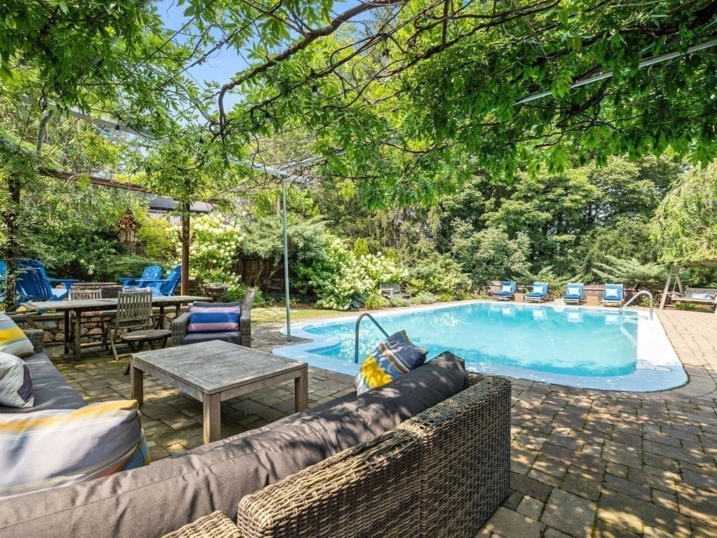 228 Wolcott Road Brookline, MA 02467 - Photo 18 of 29 a view of a backyard with plants and outdoor seating