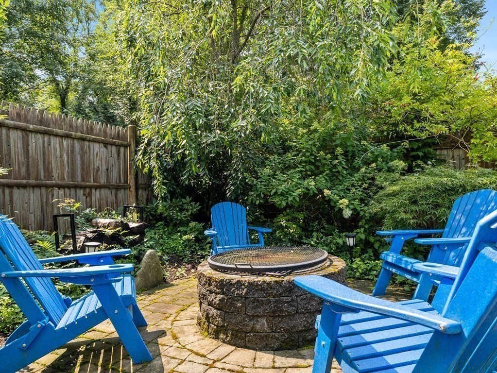 228 Wolcott Road Brookline, MA 02467 - Photo 20 of 29 a view of a backyard with furniture and outdoor seating