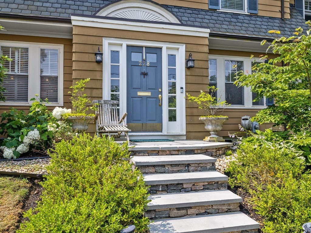 228 Wolcott Road Brookline, MA 02467 - Photo 2 of 29 a view of a house with potted plants