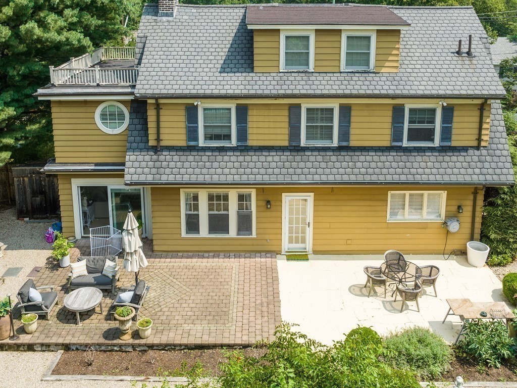 228 Wolcott Road Brookline, MA 02467 - Photo 24 of 29 front view of a house with a yard