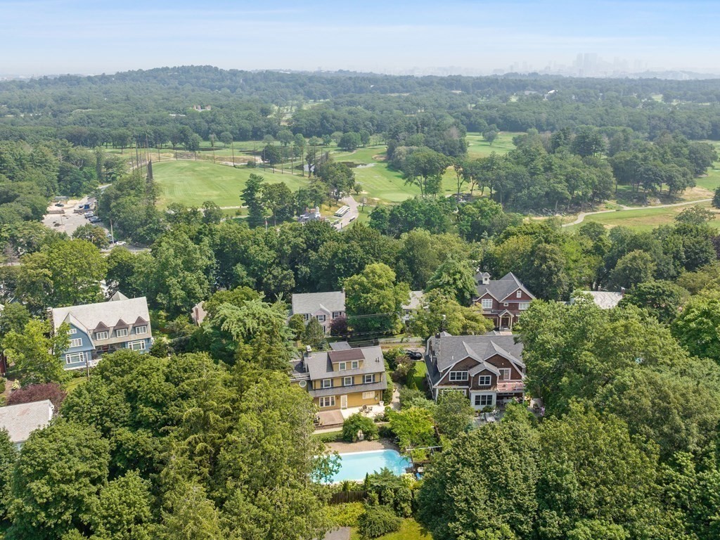 228 Wolcott Road Brookline, MA 02467 - Photo 26 of 29 an aerial view of a town with trees