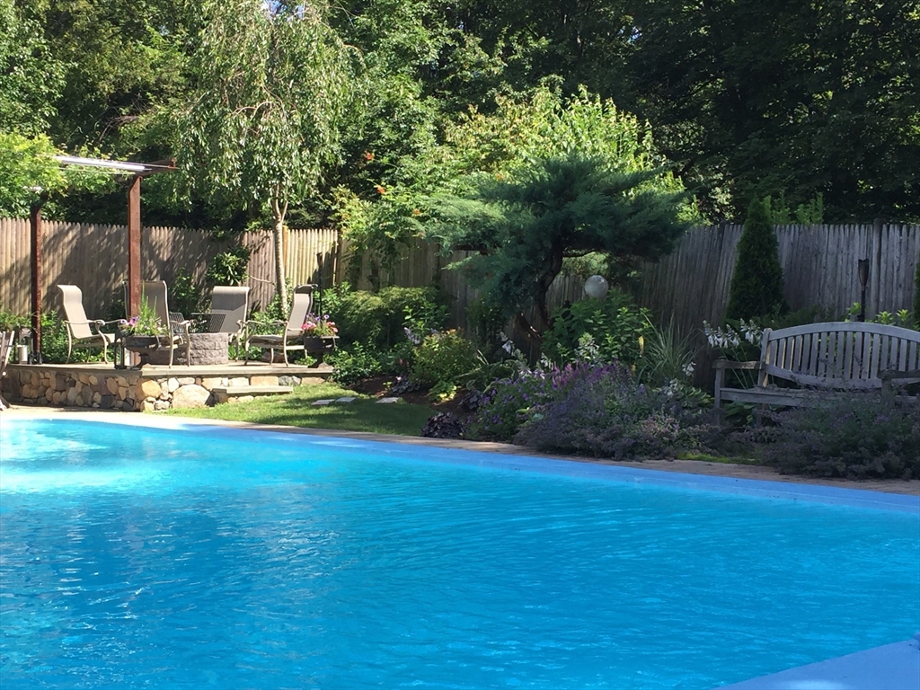 228 Wolcott Road Brookline, MA 02467 - Photo 29 of 29 a view of swimming pool with sitting area and garden