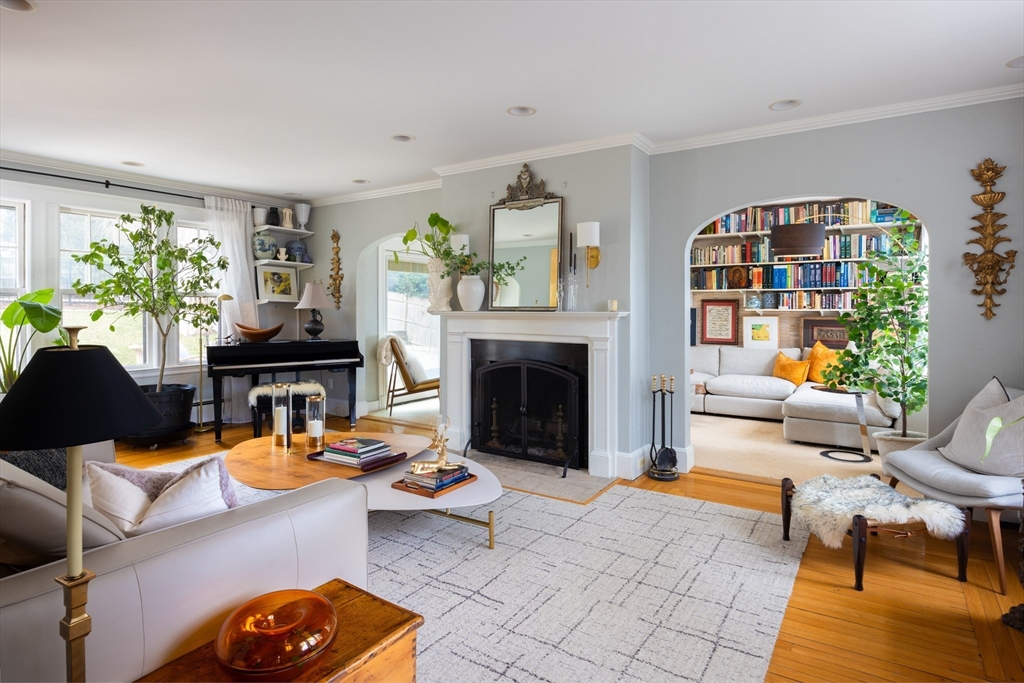 228 Wolcott Road Brookline, MA 02467 - Photo 7 of 29 a living room with furniture a fireplace and a potted plant