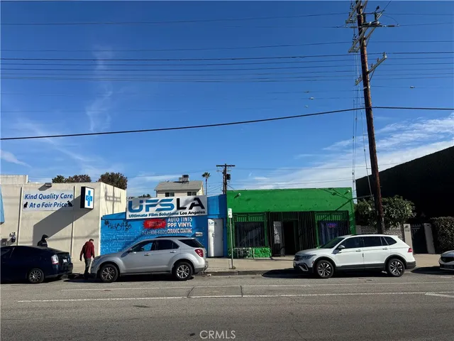 a view of street with parked cars