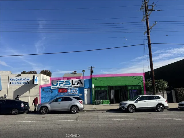 a view of cars parked in front of a building