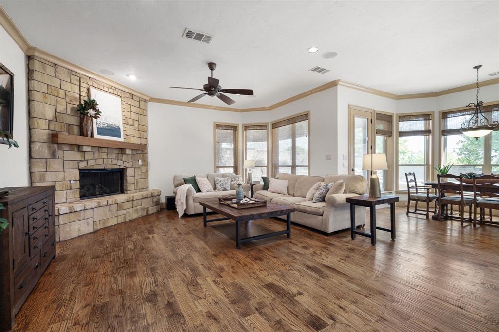 771 Hayden Road Lantana, TX 76226 - Photo 14 of 40 Oversized main living area with a stone fireplace!