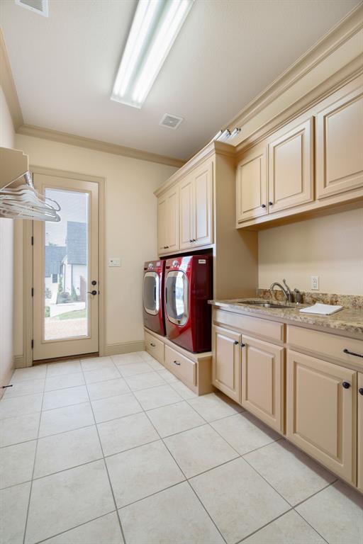771 Hayden Road Lantana, TX 76226 - Photo 35 of 40 Laundry room boasts large built-ins and drawers for added storage!