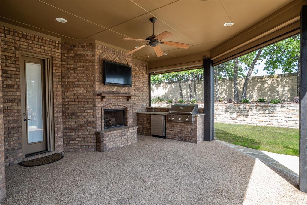 771 Hayden Road Lantana, TX 76226 - Photo 39 of 40 Outdoor living space with a fireplace and kitchen!