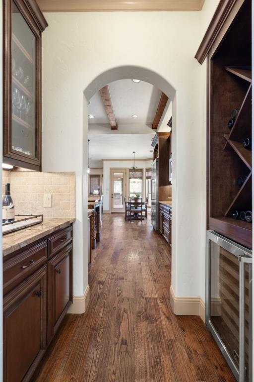 771 Hayden Road Lantana, TX 76226 - Photo 7 of 40 Wine room area is nestled in a cozy area with rich wooden shelves!