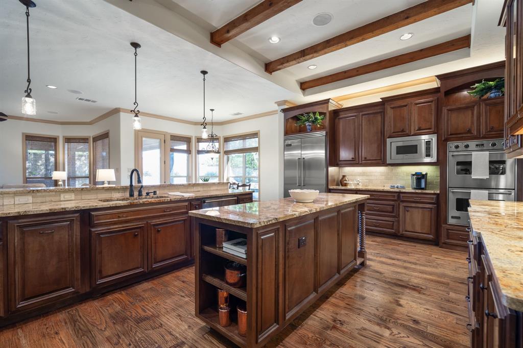 771 Hayden Road Lantana, TX 76226 - Photo 8 of 40 Wooden beams and large island!