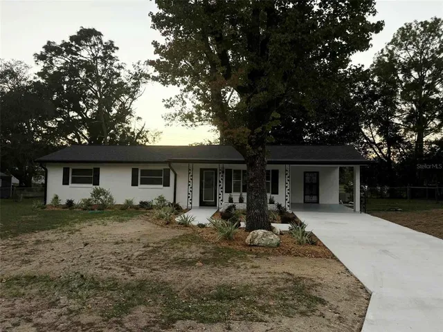 a front view of a house with yard