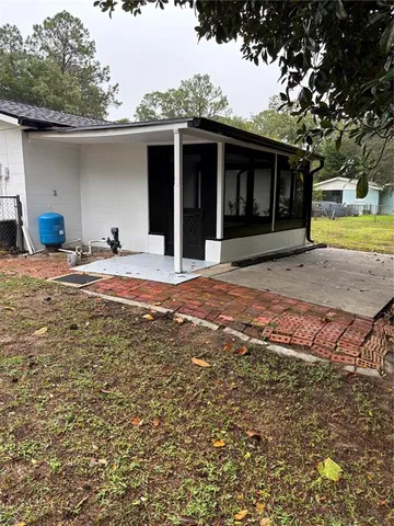 a house view with a backyard space