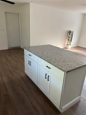 a view of cabinets and wooden floor