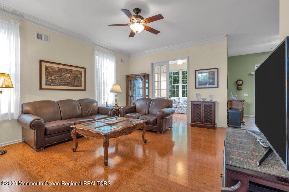 10 Crooked Stick Road Jackson, NJ 08527 - Photo 11 of 52 a living room with furniture flat screen tv and a large window