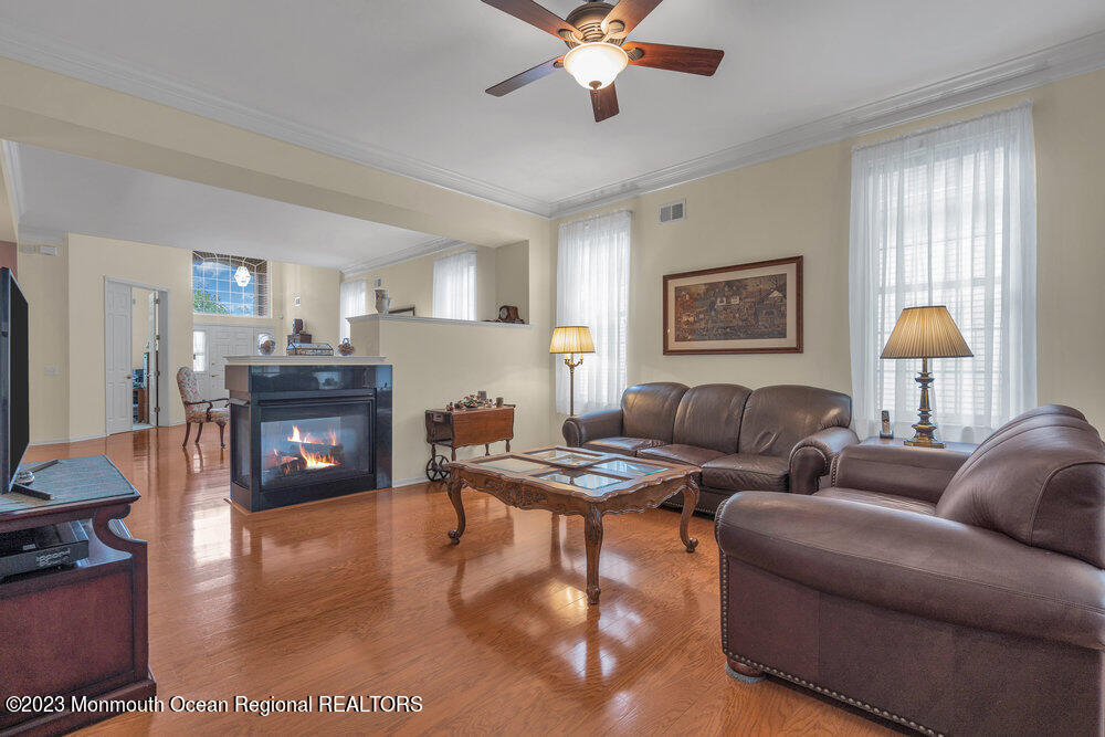 10 Crooked Stick Road Jackson, NJ 08527 - Photo 12 of 52 a living room with furniture and a wooden floor