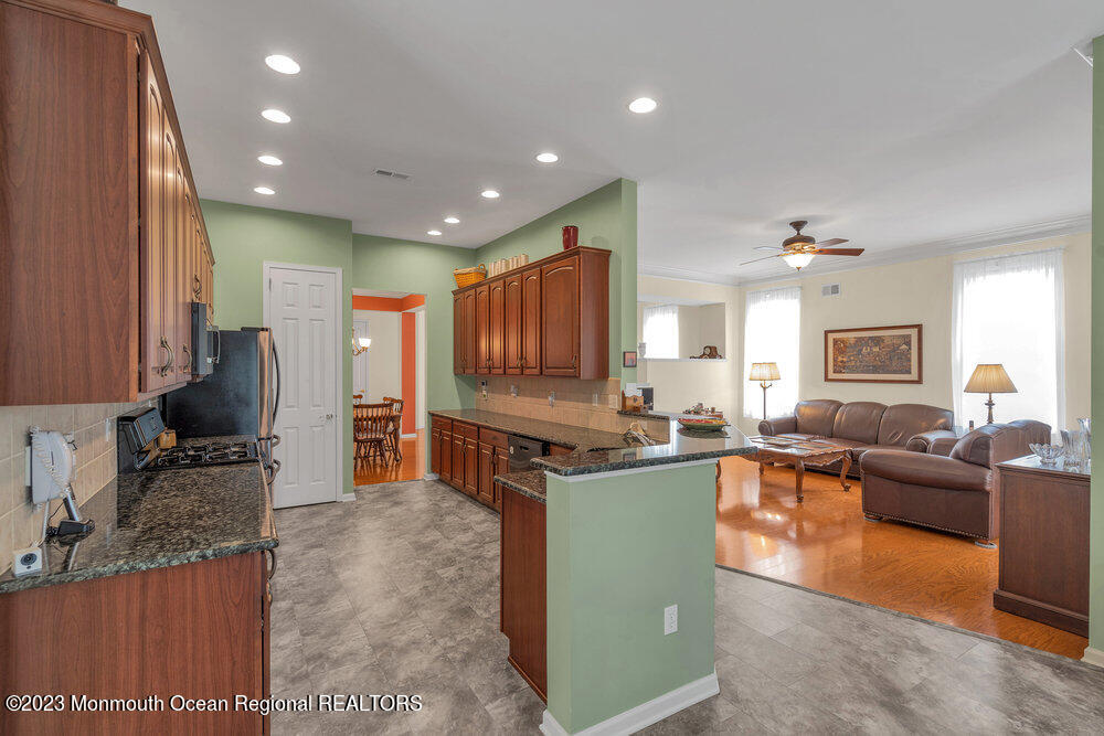 10 Crooked Stick Road Jackson, NJ 08527 - Photo 17 of 52 a view of kitchen with kitchen island stainless steel appliances refrigerator stove dining table and chairs