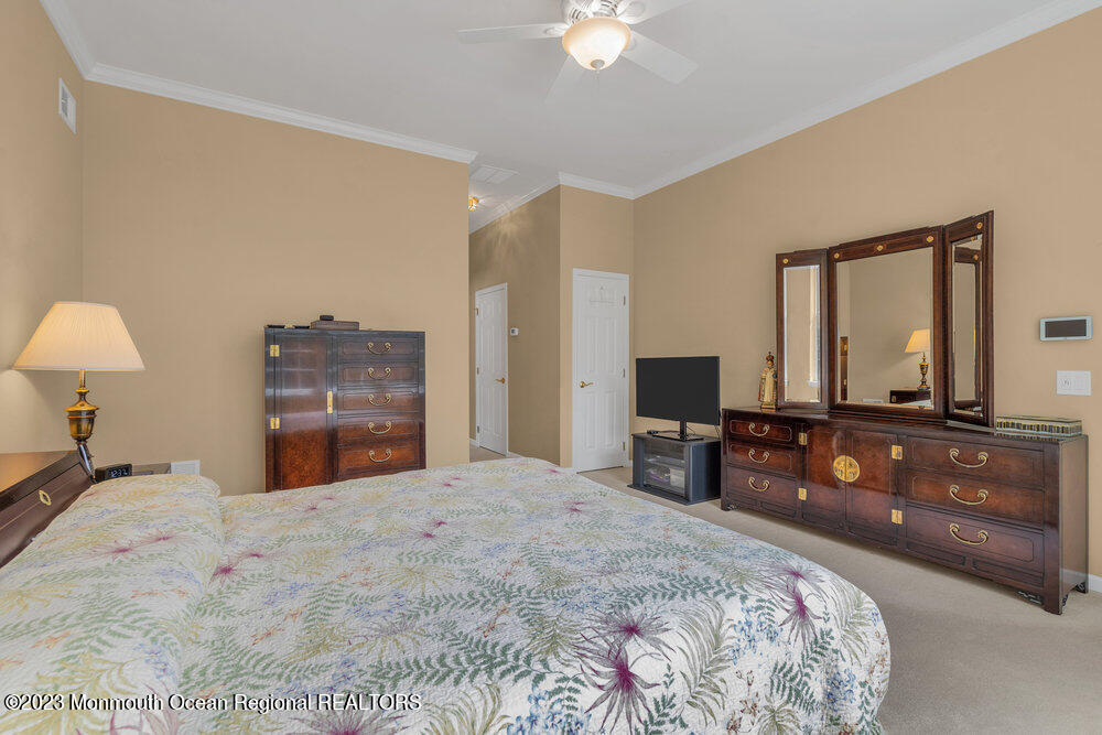 10 Crooked Stick Road Jackson, NJ 08527 - Photo 27 of 52 a bedroom with a bed and a dresser in it