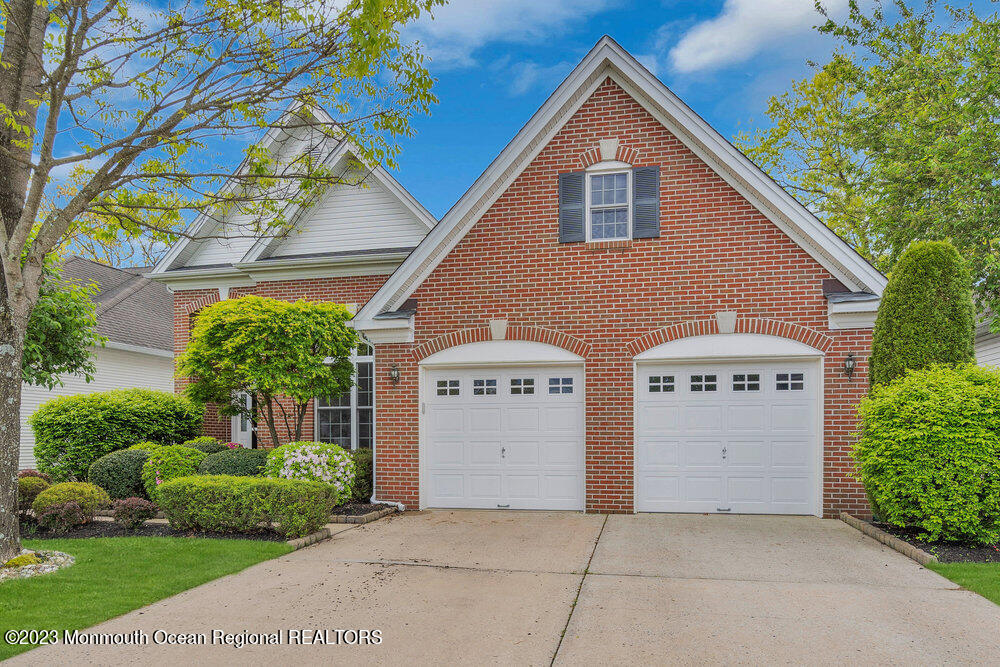 10 Crooked Stick Road Jackson, NJ 08527 - Photo 3 of 52 a front view of a house with a yard and garage
