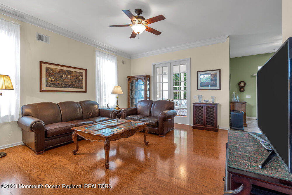 10 Crooked Stick Road Jackson, NJ 08527 - Photo 10 of 52 a living room with furniture ceiling fan and a wooden floor