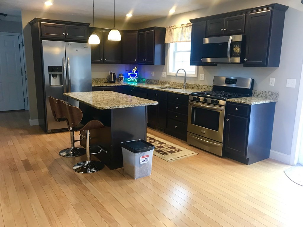 162 Fitchburg Road Townsend, MA 01469 - Photo 5 of 13 a kitchen with a sink appliances and cabinets