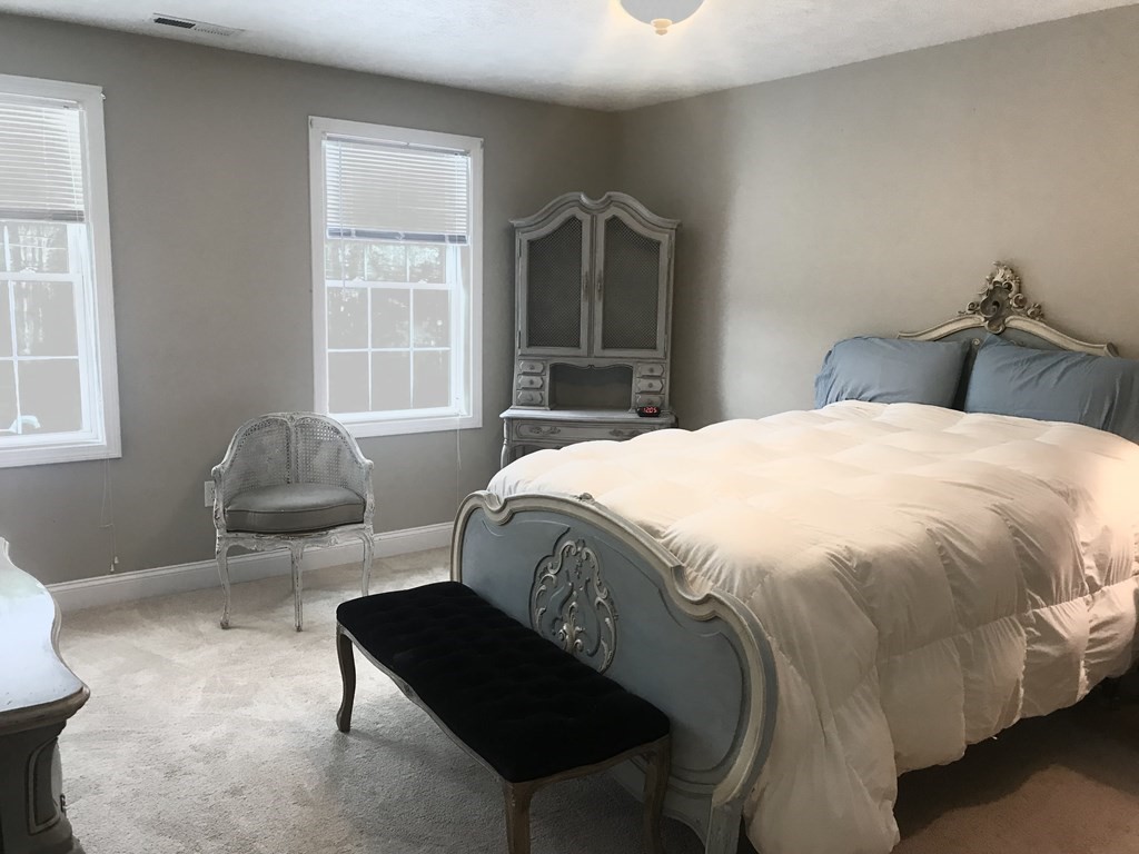 162 Fitchburg Road Townsend, MA 01469 - Photo 9 of 13 a bedroom with a bed and window