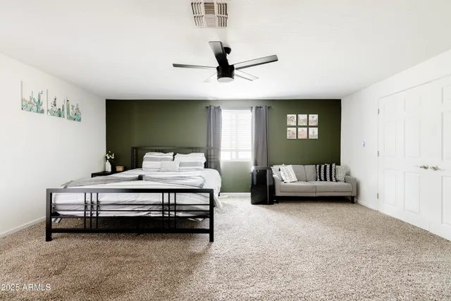 a bedroom with furniture and window